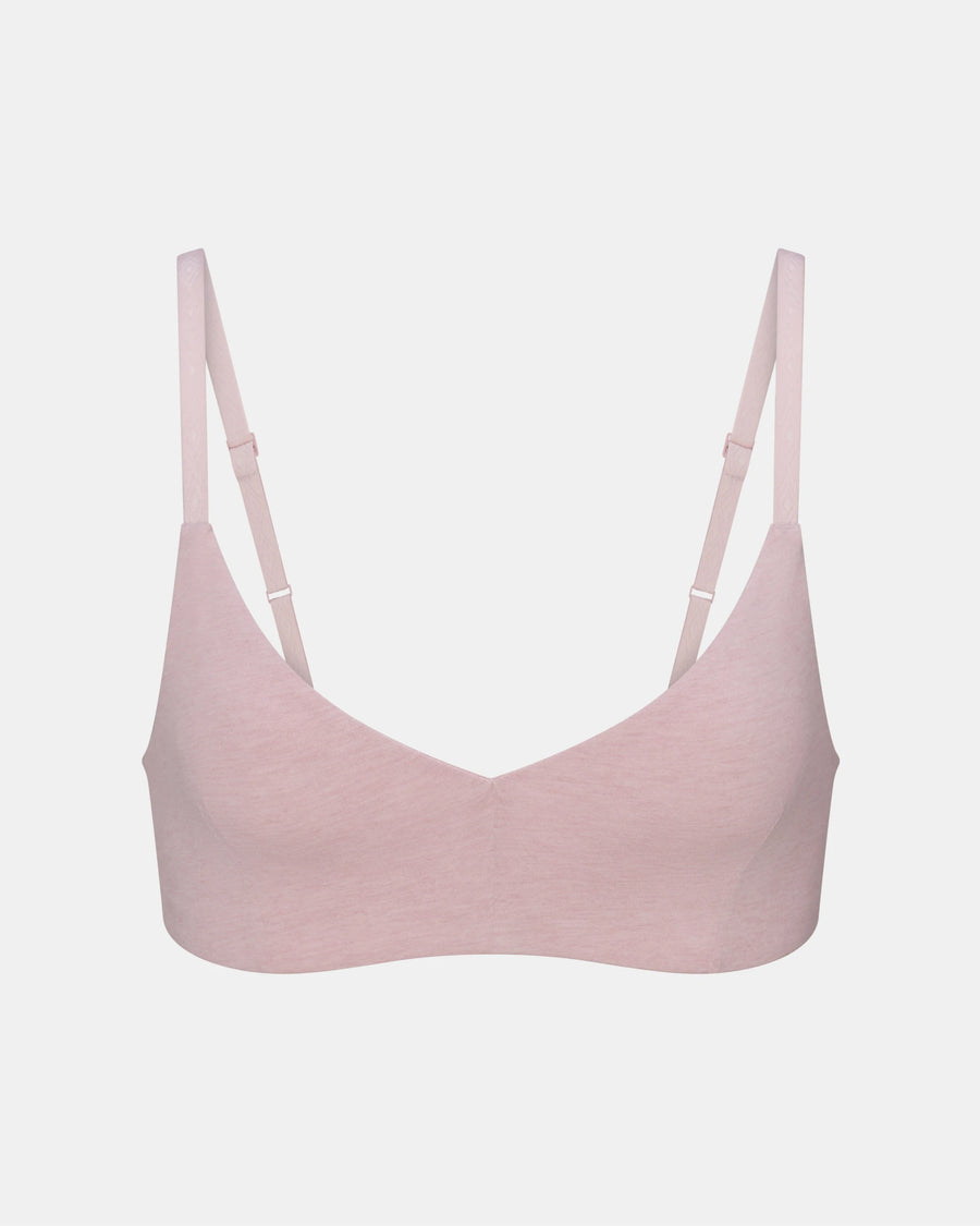 Pink bralette on a light gray background