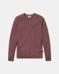Maroon sweater on a light gray background
