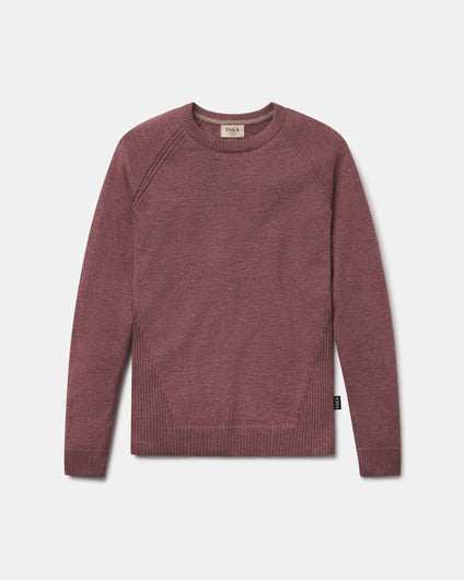 Maroon sweater on a light gray background