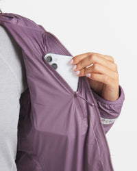 Hand on Phone in Interior Side Pocket of Amethyst Purple Women's Apu Lightweight Puffer Jacket – PAKA Apparel
