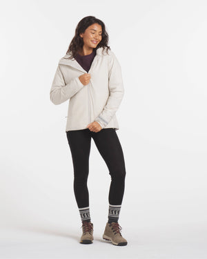 Full-Height Shot of Woman Zipping Up Sustainable Women's Apu Lightweight Puffer Jacket in Noni / White – PAKA Apparel