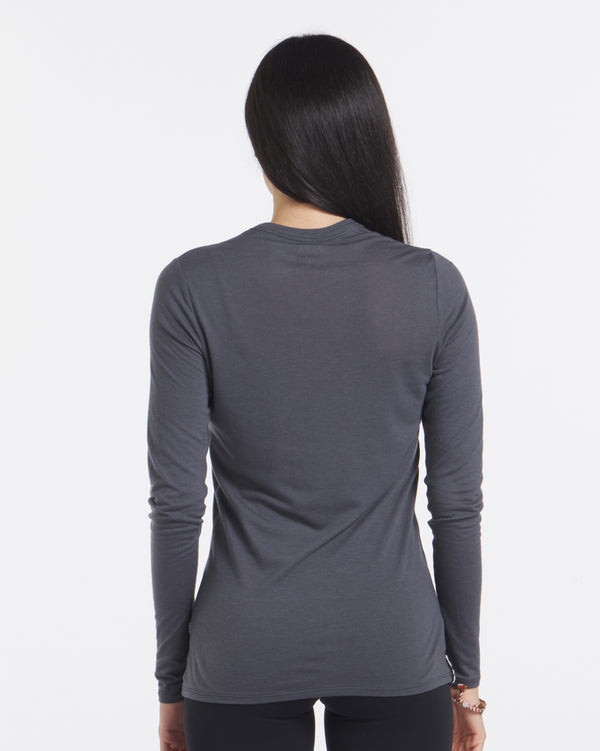 Backshot of Model Wearing Aire Charcoal Blue Women's Tencel and Alpaca Long Sleeve Shirt – PAKA Apparel