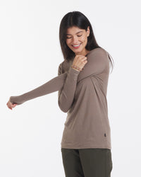 Women Stretching Wearing Aire Natural Alpaca Fiber Long Sleeve Shirt in Walnut / Tan – PAKA Apparel