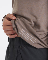 Close Up of Text on Underside of Aire Walnut / Tan Women’s Alpaca and Tencel Long Sleeve Shirt – PAKA Apparel
