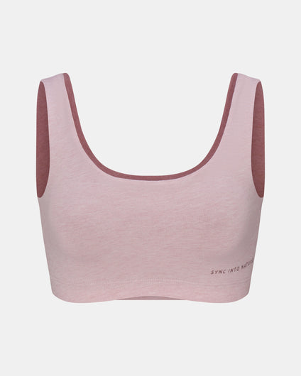 Pink sports bra with maroon straps on a light gray background
