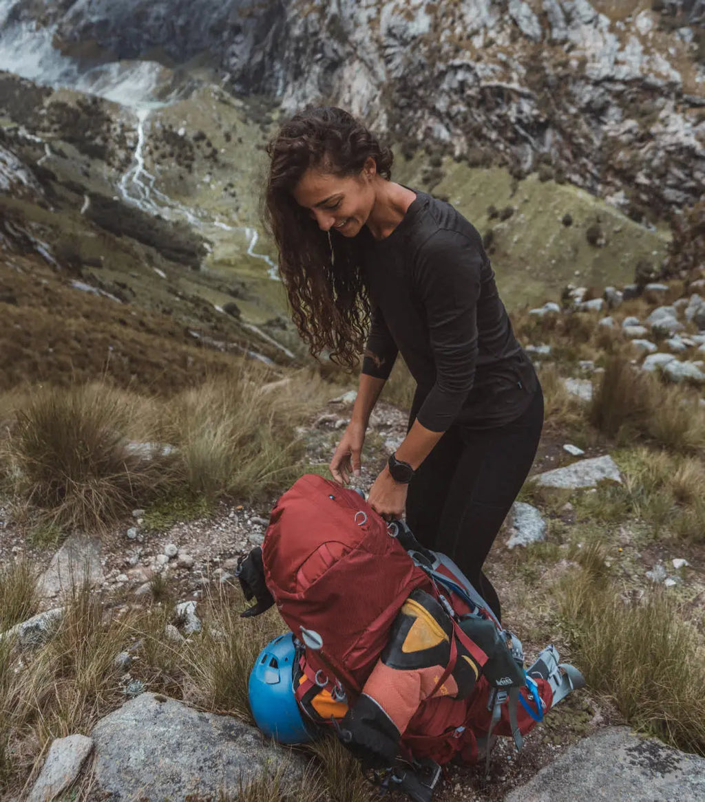 Women on Mountainside in Long Sleeve Hiking Shirt with Valley Stream Below – PAKA Apparel