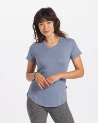 Model Smiling in Women's Breathable Alpaca T-Shirt in Ausangate Lake / Light Blue – PAKA Apparel