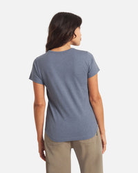 Back view, Women’s Essential Tee, bluestone, regular fit crewneck with short sleeves and curved hem on white background