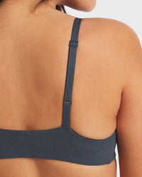 Rear view of Women’s Essential Triangle Bralette in navy showing adjustable textured straps and wide elastic underband on model