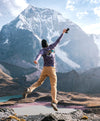 Ausangate mountain with man jumping in purple shirt