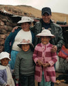An alpaca farmer and his family.