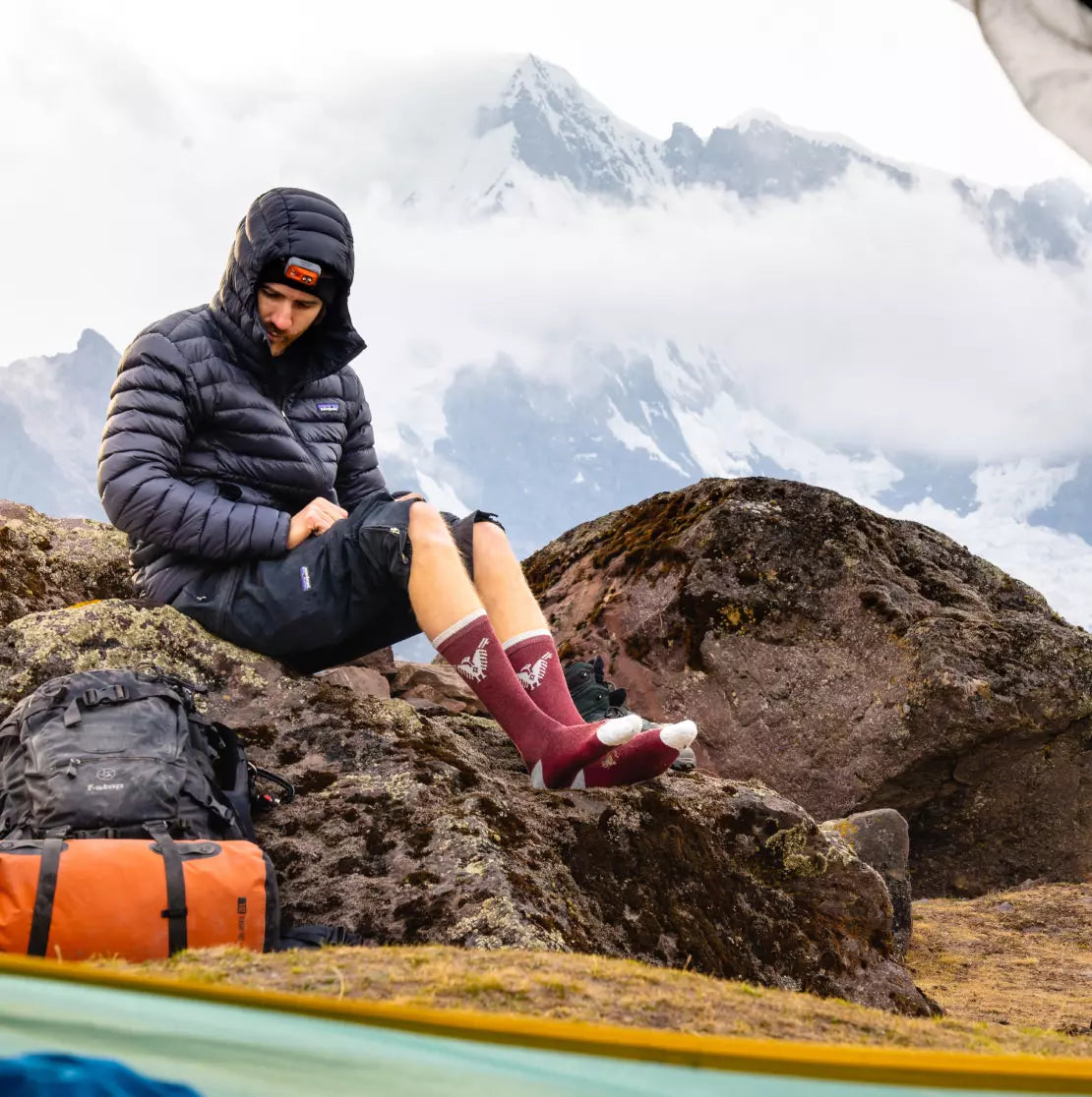 A man wearing our Condor socks in the Andes mountains.
