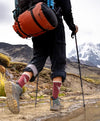 A hiker in the Andes mountains wearing our maroon Condor socks 