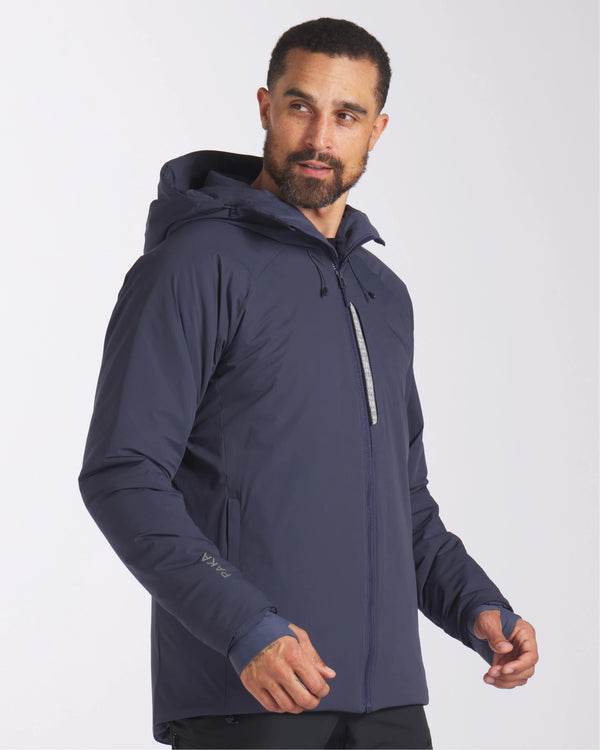 Model Looking Sideward in Apu Navy Men's Parka Ethical Winter Ski Jacket with Natural Fiber Insulation – PAKA Apparel