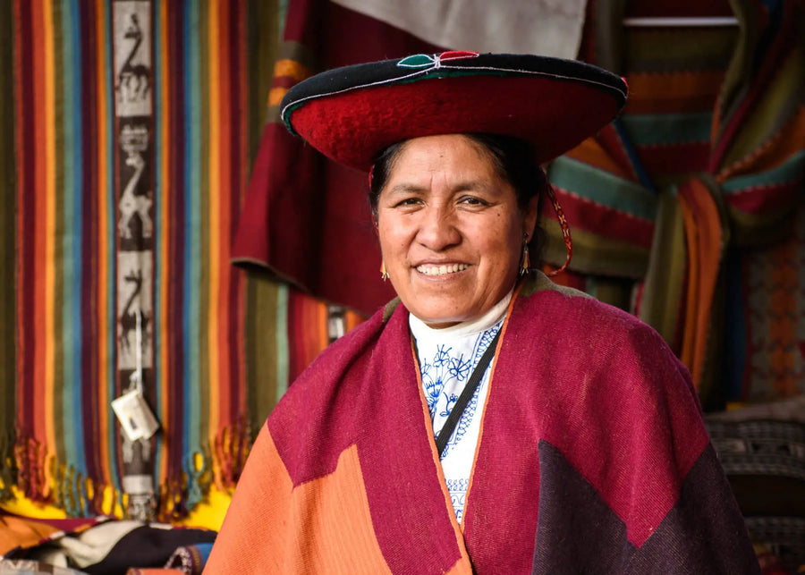 Nilda, a legendary Quechua weaver smiling and wearing traditional Cusco garments