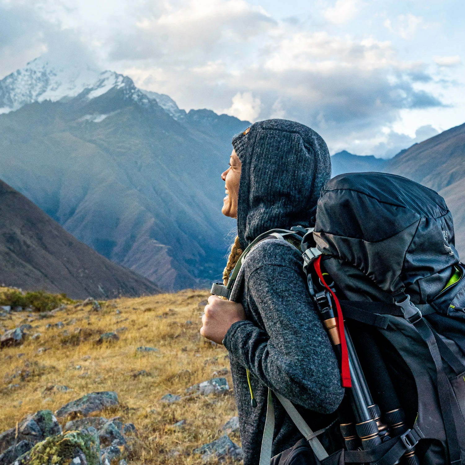 A woman in the mountains wearing a Charcoal alpaca Hoodie