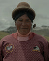 A Quechua woman smiling. 