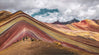 Rainbow mountain - a mountain with many colors - red yellow and blue.