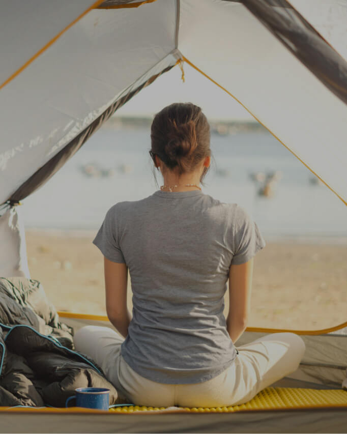Woman Wearing Grey Alpaca T-Shirt While Meditating in a Tent by a Lake – PAKA Apparel
