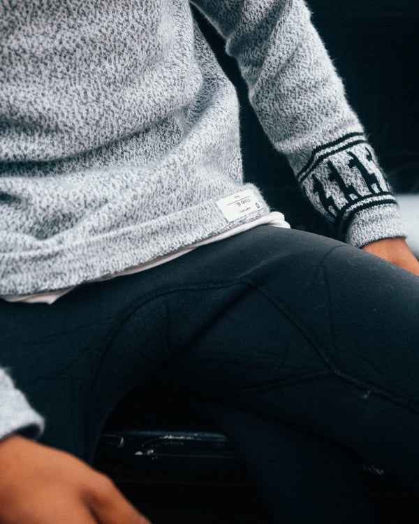 Man wearing the costa sitting down