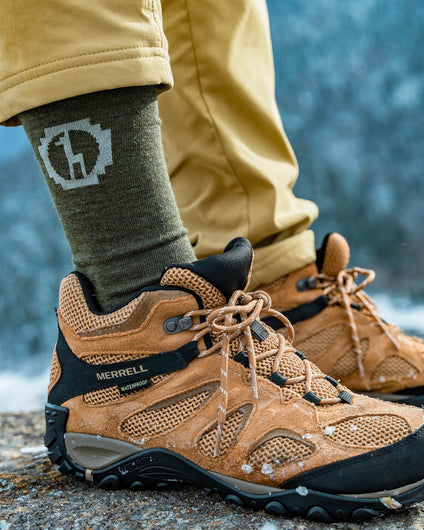 Andean Moss / Green Alpaca Wool Crew Sock on Right Foot Worn with Merrell Hiking Boots – PAKA Apparel