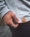 Close-up of the leather tag on the Hoodie by Paka Apparel