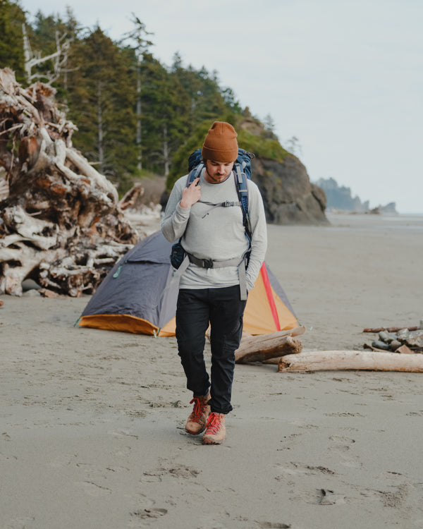 Man Hiking Along Beach in Heather Grey Aire Lightweight Alpaca Long Sleeve Shirt – PAKA Apparel