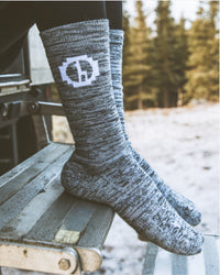 Feet Wearing Grey Spacedye Alpaca Wool Thermal Socks Resting on Metal Steps Outdoors – PAKA Apparel