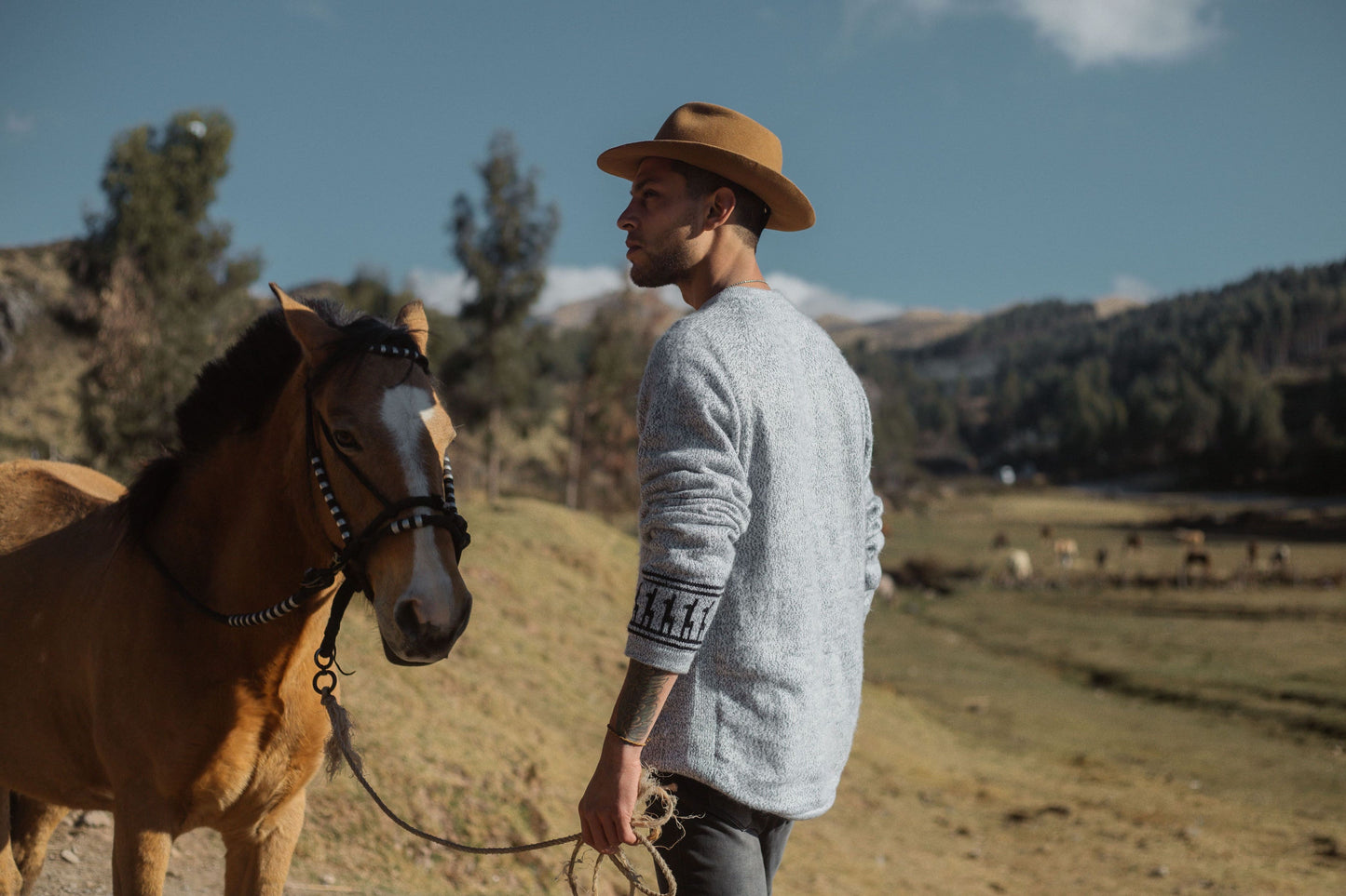 Cowboy with horse in Cusco, Peru wearing the Costa