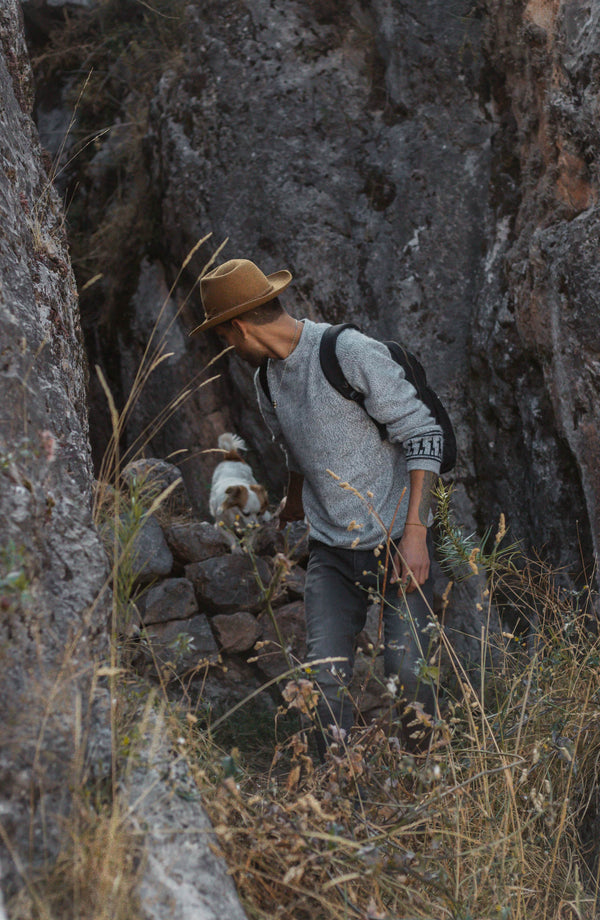 Male Cowboy walking through Templo de la Luna in the Costa