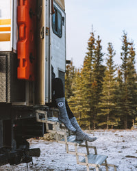 Spacedye grey alpaca socks with white logo