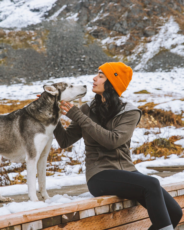 Woman model sitting with dog wearing Women's Breathe Full Zip