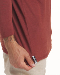 Close Up of Alpaca Tag at Waist of Clay / Red Aire Men's Moisture Wicking Long Sleeve Shirt – PAKA Apparel