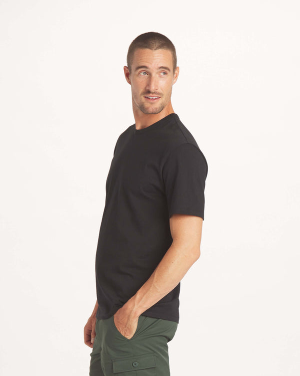 Man looking back wearing the Luna Men's Tee