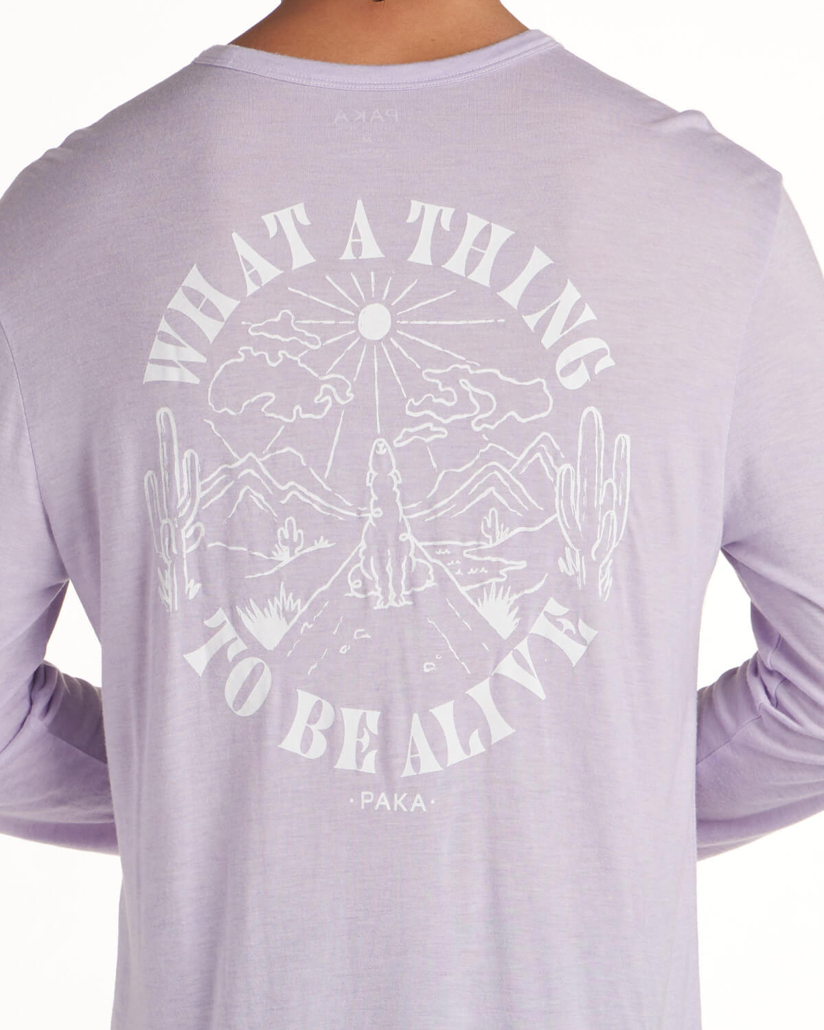 Lavender alpaca base layer on model back shot with image of alpaca and text that says "what a thing to be alive"