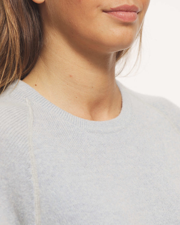 Close-up of Sky Blue Crewneck by Paka Apparel on Woman Model