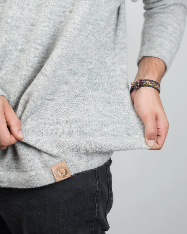 Man's Hands Pulling at Waist of The Original Crew Alpaca Crewneck Sweater in Light Grey – PAKA Apparel