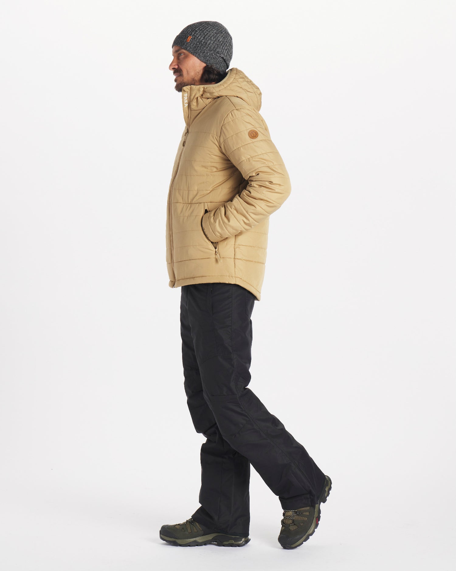 Mens tan jacket with white Paka and tag on arm