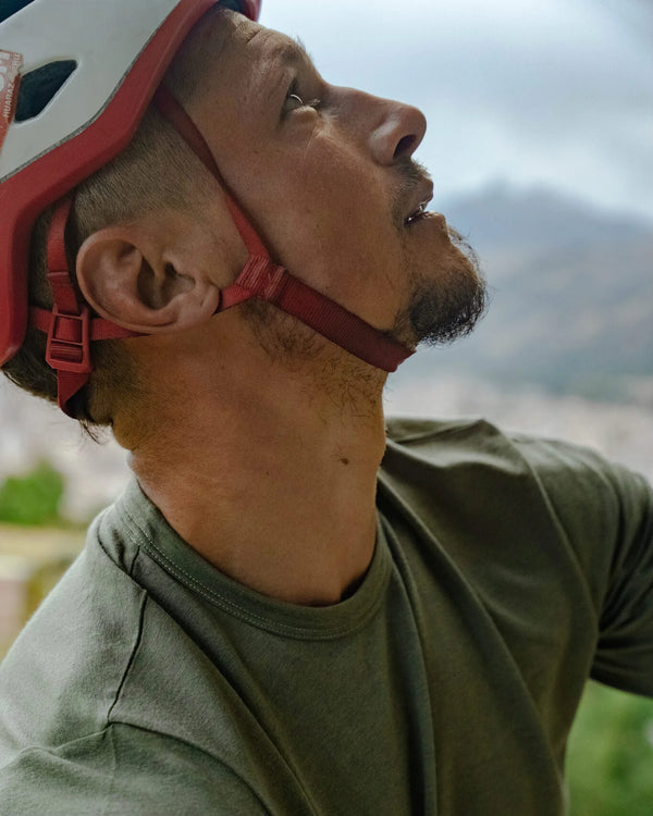 Close Up of Rock Climber Wearing Eucalyptus / Green Aire Men's Long Sleeve Alpaca and Tencel Shirt – PAKA Apparel