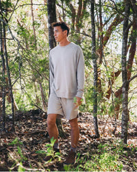 Man in Woods Wearing Timber / Grey Alpaca Terry Cloth Shorts for Hiking and Casual – PAKA Apparel