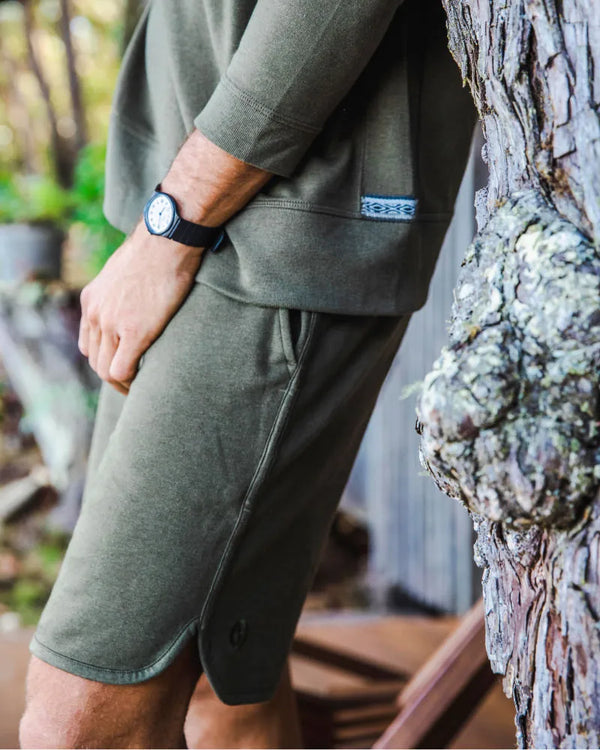 Lower Half of Model Against Tree Wearing Andean Moss / Dark Green Men's Terry Cloth Lounge Shorts – PAKA Apparel