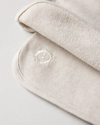 Close Up of Stitched PAKA Logo on Sandstone / Off White Men's Stylish Alpaca Wool Blend Terry Cloth Shorts – PAKA Apparel